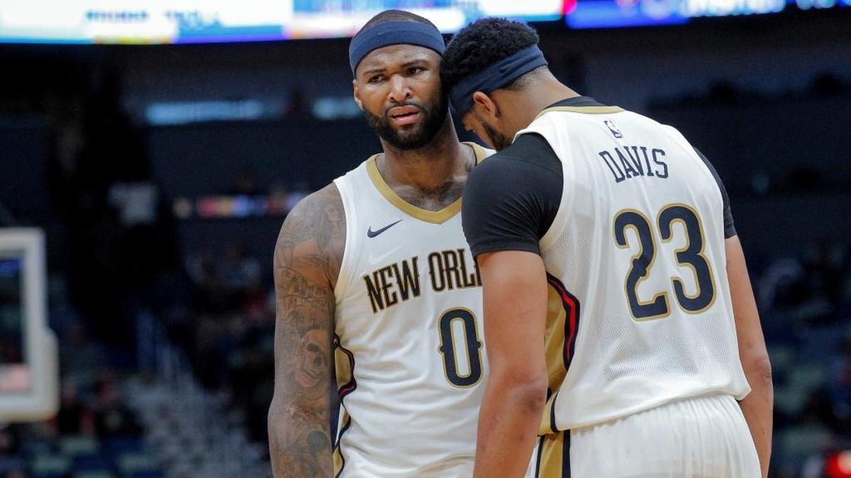 New Orleans Pelicans forward Anthony Davis (23) talks to forward DeMarcus Cousins (0) after Cousins was knocked to the court but no foul called in the second half of an NBA basketball game against the Orlando Magic in New Orleans, Monday, Oct. 30, 2017. The Magic won 115-99.