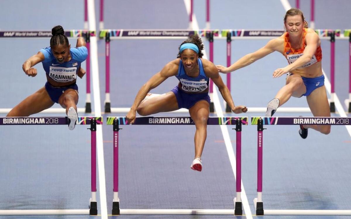 From left, United States silver-medalist Christina Manning, United States gold-medalist Kendra Harrison and Netherlands bronze-medalist Nadine Visser competed in the women’s 60-meter hurdles finals at the World Athletics Indoor Championships in Birmingham, Britain, on Saturday.