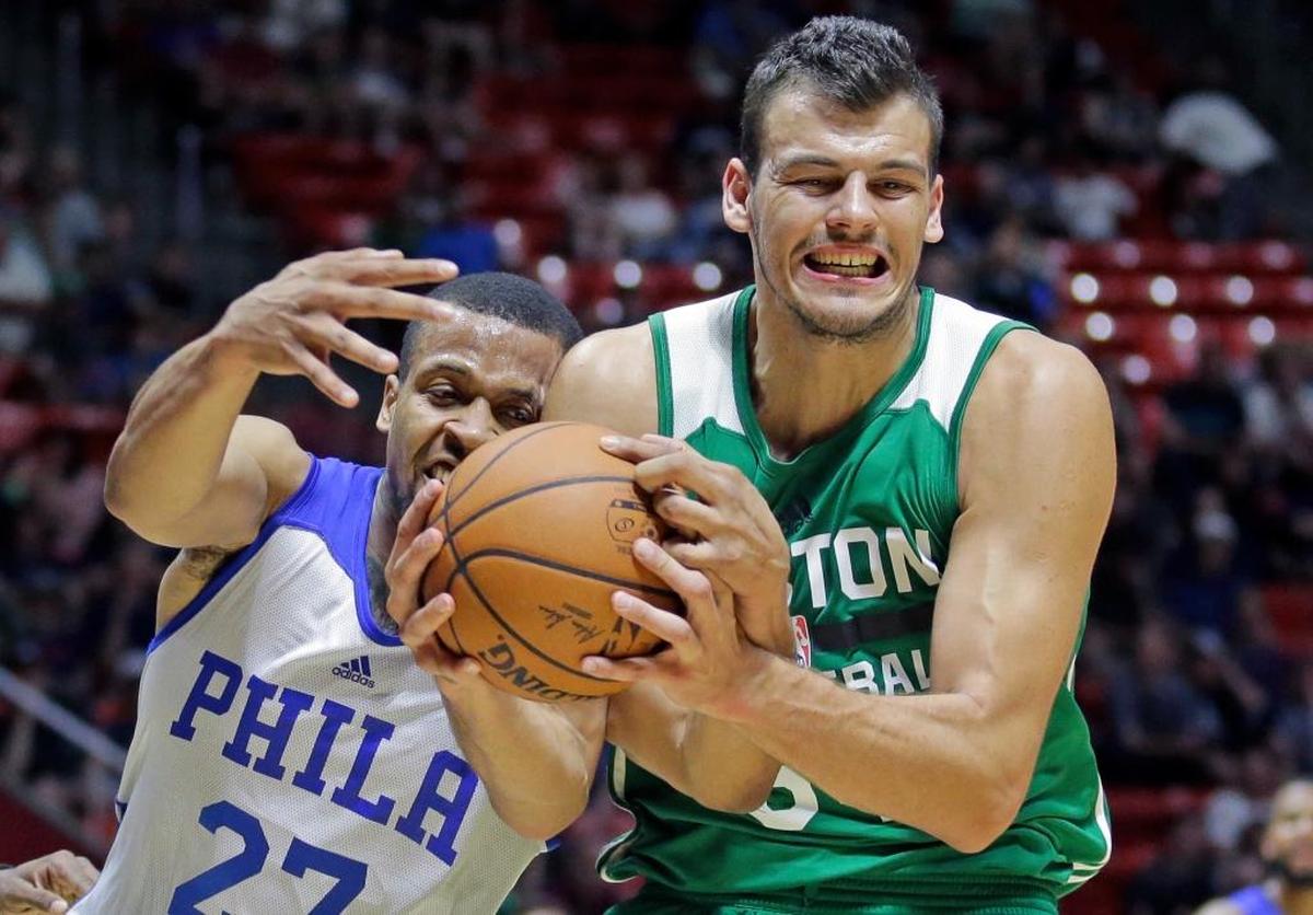 Philadelphia 76ers guard Isaiah Briscoe (27) and Boston Celtics center Ante Zizic (54) battled for a rebound during the first half of an NBA summer league basketball game Monday, July 3, 2017, in Salt Lake City.
