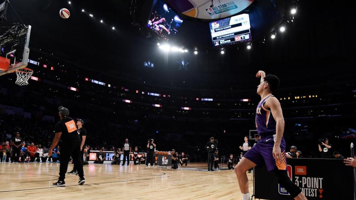 Phoenix Suns’ Devin Booker watches a shot during the NBA basketball All-Star weekend 3-Point contest Saturday, Feb. 17, 2018, in Los Angeles. Booker won the event.