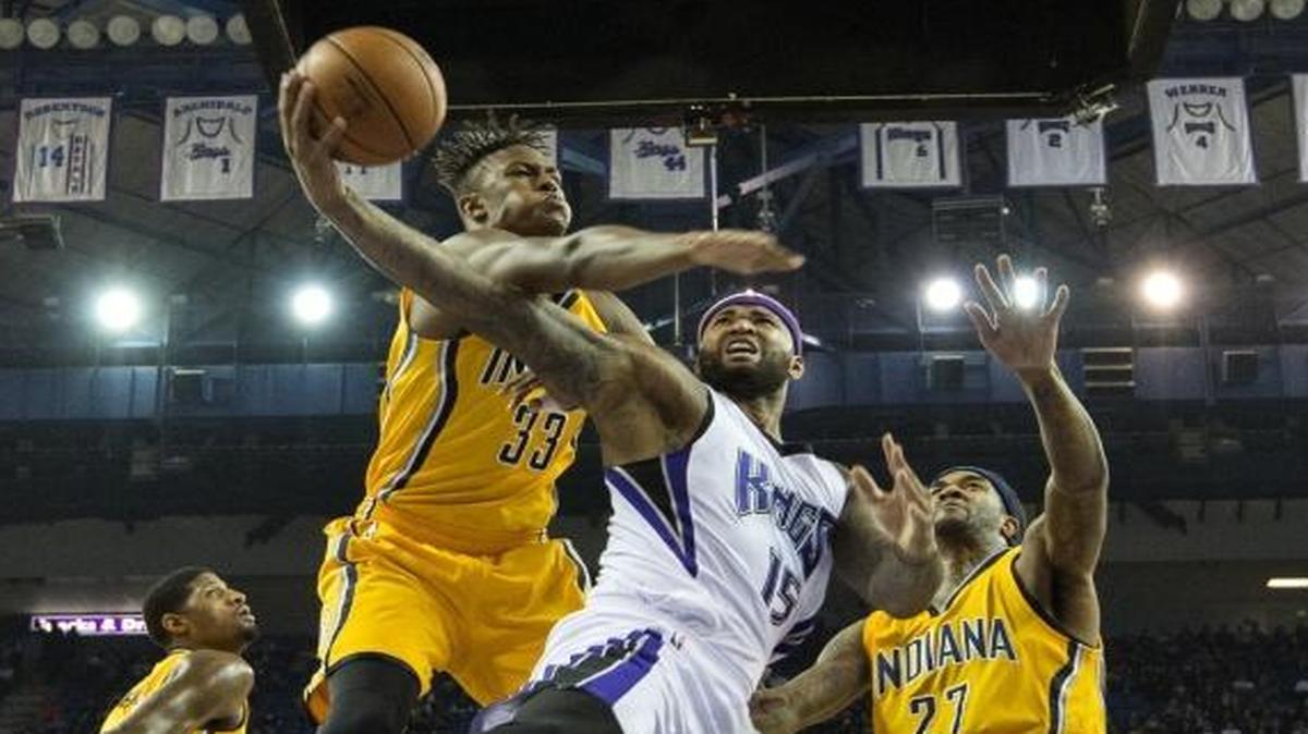 Sacramento Kings center DeMarcus Cousins (15) is fouled as he goes to the basket by Indiana Pacers forward Myles Turner (33) on Saturday, January 23, 2016, at Sleep Train Arena in Sacramento.