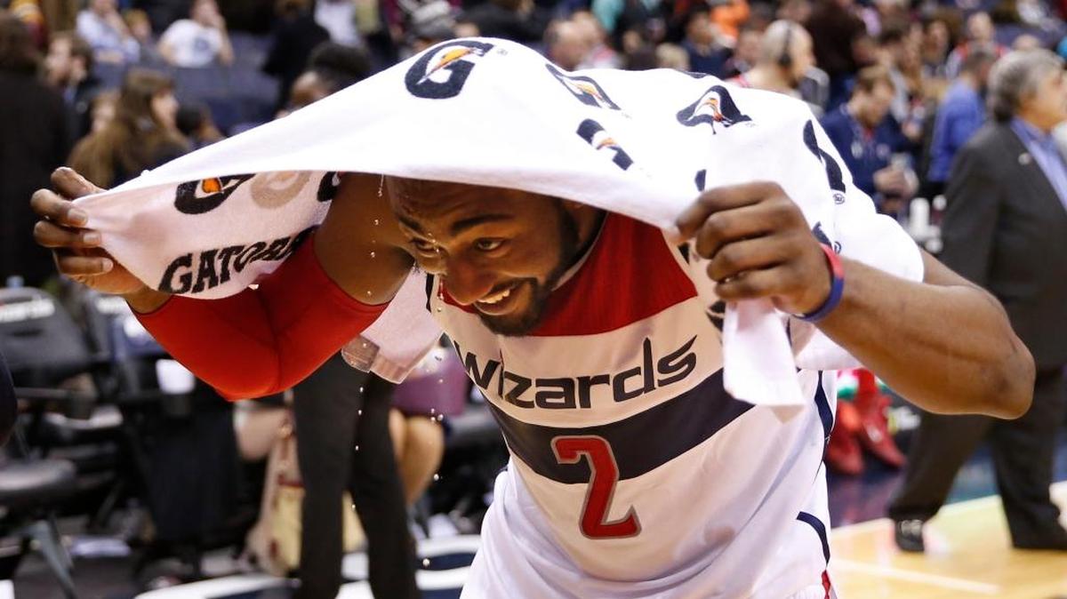John Wall, who got his fourth career triple-double, smiled after teammate DeJuan Blair dumped two cups of water onto his head after the team’s win over the 76ers on Friday, Feb. 5, 2016, in Washington. The Wizards won 106-94.