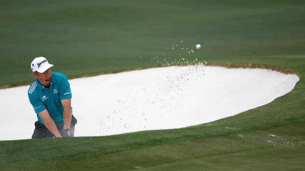 J.B. Holmes chipped out of a bunker on the second hole during the final round of the Masters on Sunday, April 10, 2016, in Augusta, Ga.