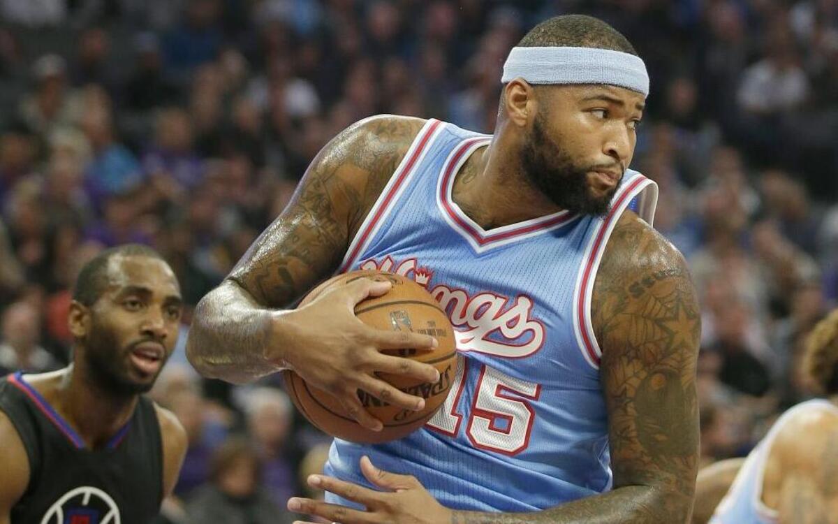 Sacramento Kings center DeMarcus Cousins grabs a rebound near Los Angeles Clippers forward Luc Richard Mbah a Moute during the first quarter of an NBA basketball game in Sacramento, Calif., Friday, Nov. 18, 2016.