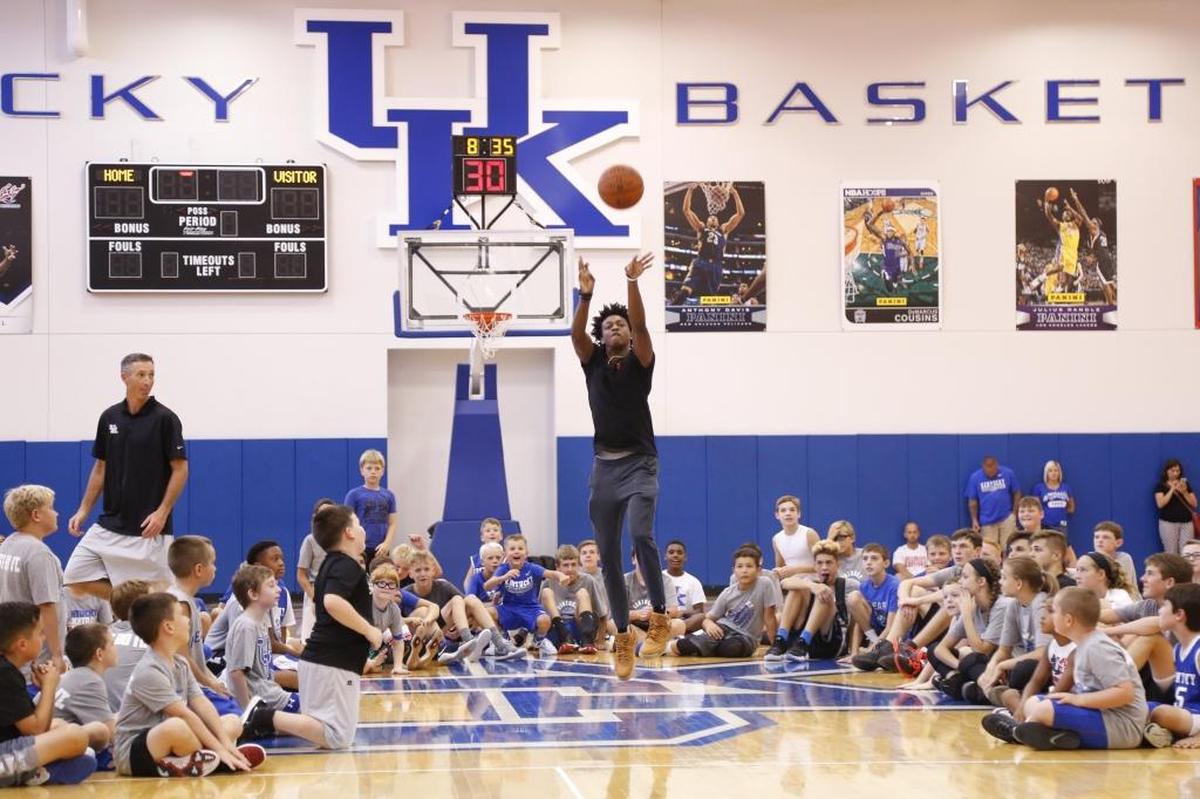 Former UK Basketball player De’Aaron Fox shoots a half-court shot as part of a drill during the 2017 John Calipari UK Pro Camps at the Joe Craft Center in Lexington, Ky., on Tuesday, August 1, 2017.