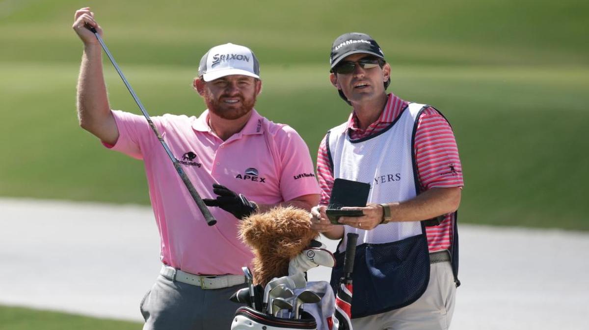 J.B. Holmes, left, and his caddie Brandon Parsons, looked at the fifth fairway during the final round of The Players Championship on Sunday in Ponte Vedra Beach, Fla.