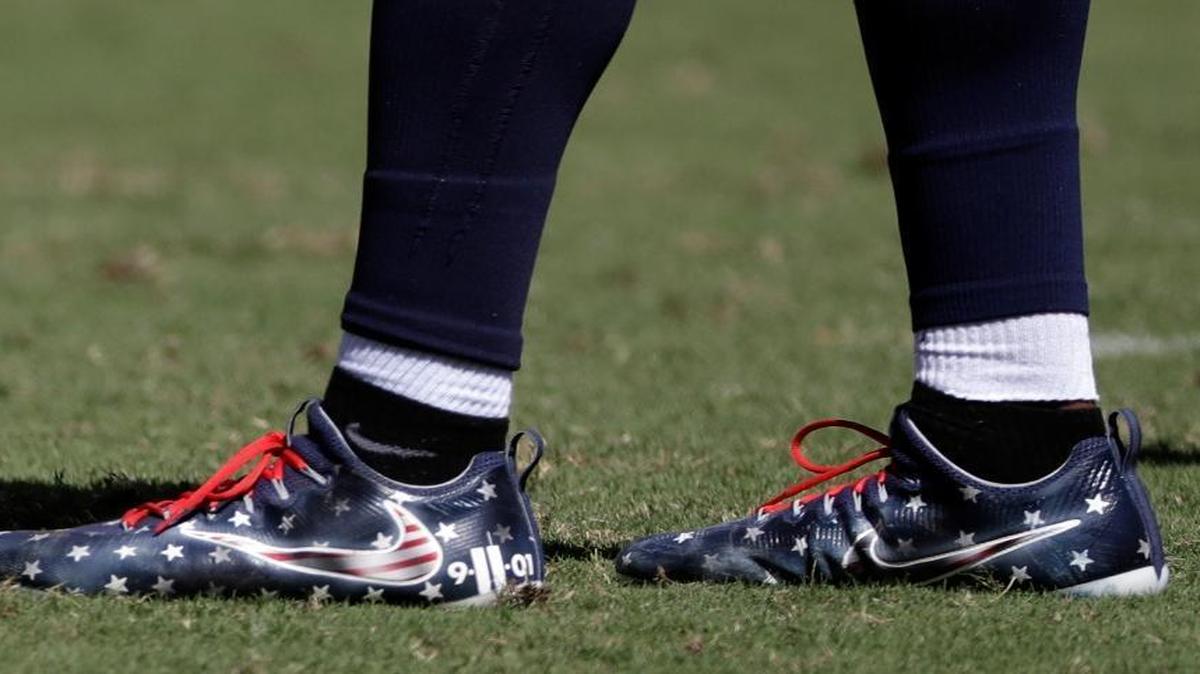 Tennessee Titans linebacker Avery Williamson wears shoes honoring victims of the 9/11 attacks in the second half of an NFL football game against the Minnesota Vikings Sunday, Sept. 11, 2016, in Nashville.