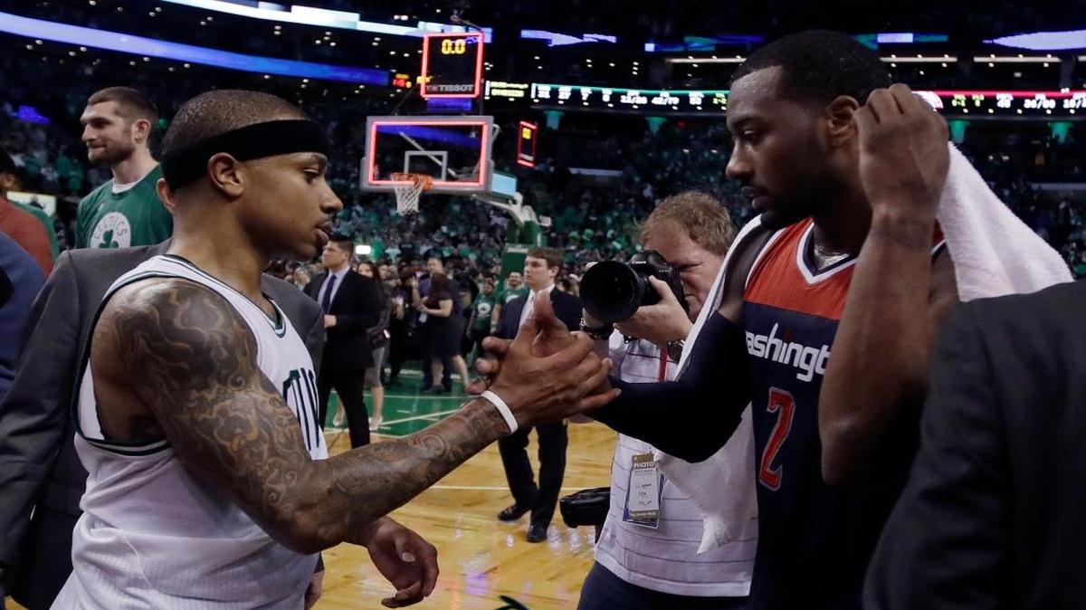 Boston guard Isaiah Thomas, left, and Washington guard John Wall speak on the court after Game 7 of a second-round playoff series on Monday, May 15, 2017, in Boston. The Celtics won 115-105 to advance to the Eastern Conference finals.