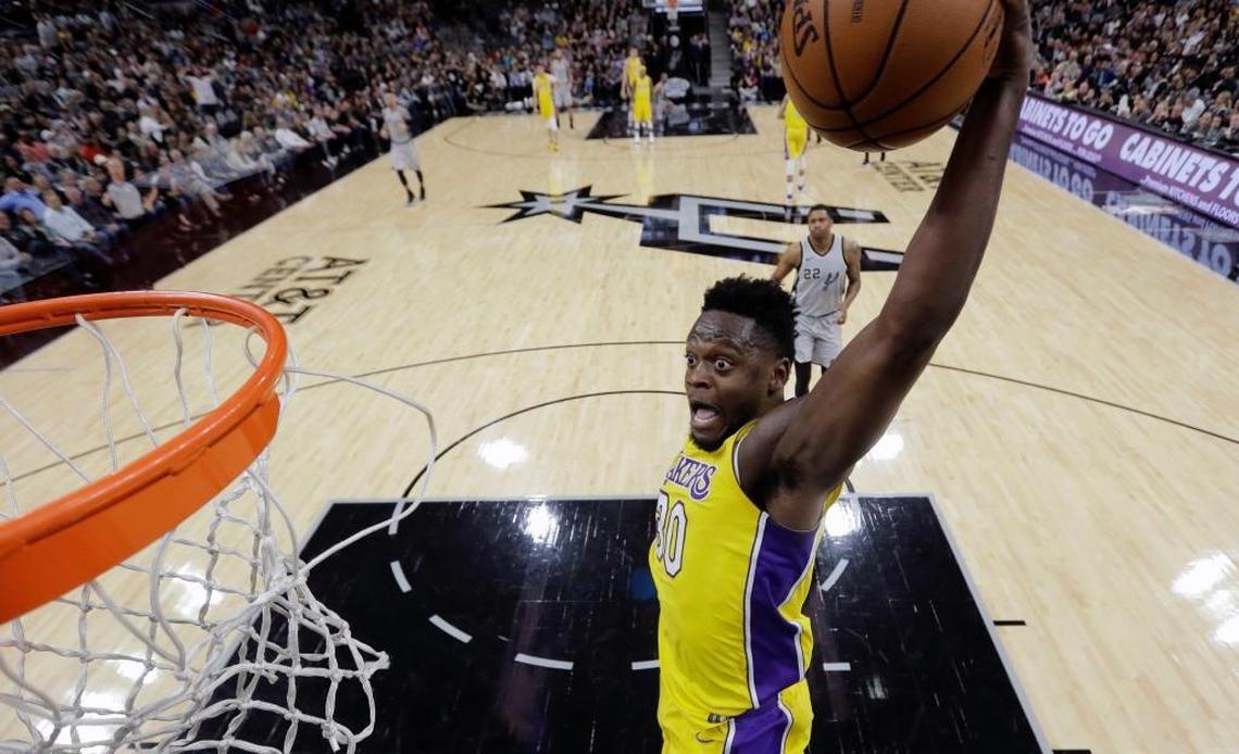 Los Angeles Lakers forward Julius Randle (30) scores against the San Antonio Spurs during the first half of an NBA basketball game, Saturday, March 3, 2018, in San Antonio.