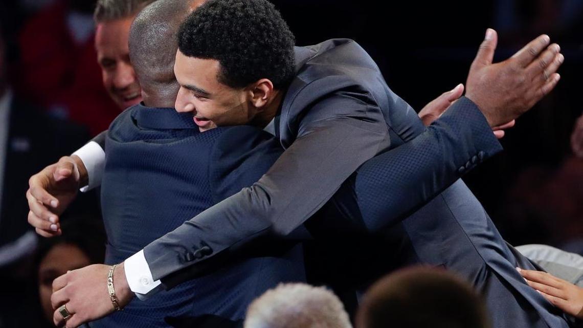 Jamal Murray hugs a supporter after being selected seventh overall by the Denver Nuggets during the NBA basketball draft, Thursday, June 23, 2016, in New York. (AP Photo/Frank Franklin II)