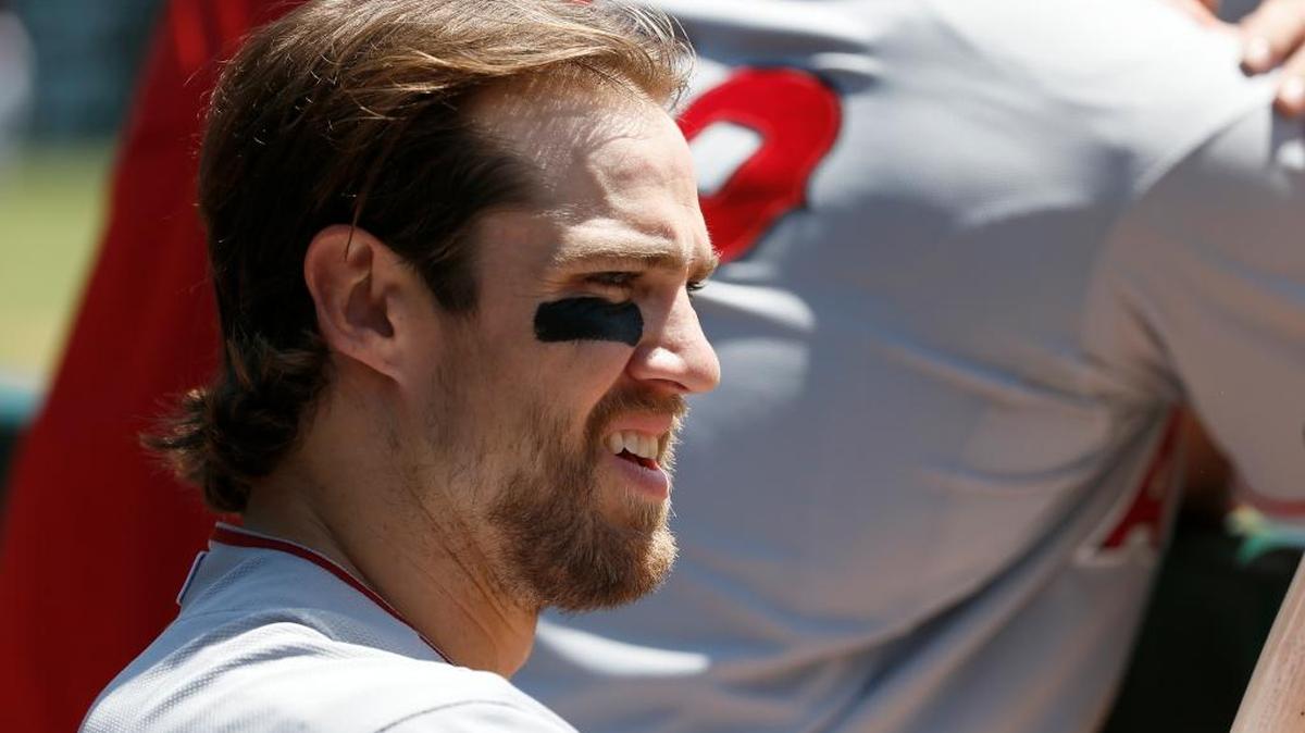 The Los Angeles Angels’ Collin Cowgill waited at the top of the dugout for his at-bat against the Texas Rangers on April 15, 2015, in Arlington, Texas.