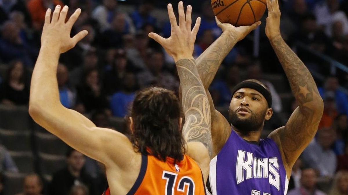 Kings forward DeMarcus Cousins (15) shot as Thunder center Steven Adams (12) defended in the first quarter on Sunday, Dec. 6, 2015.