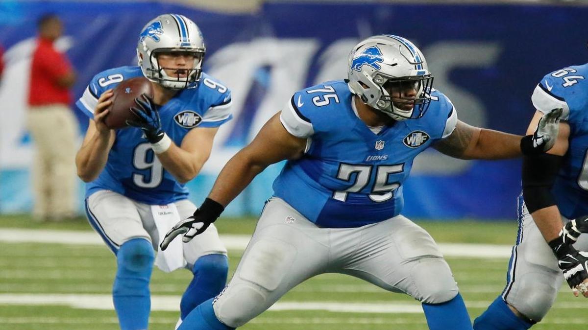 Detroit Lions guard Larry Warford (75) blocks for Detroit Lions quarterback Matthew Stafford (9) during the second half of an NFL football game against the Minnesota Vikings, Sunday, Oct. 25, 2015, in Detroit.