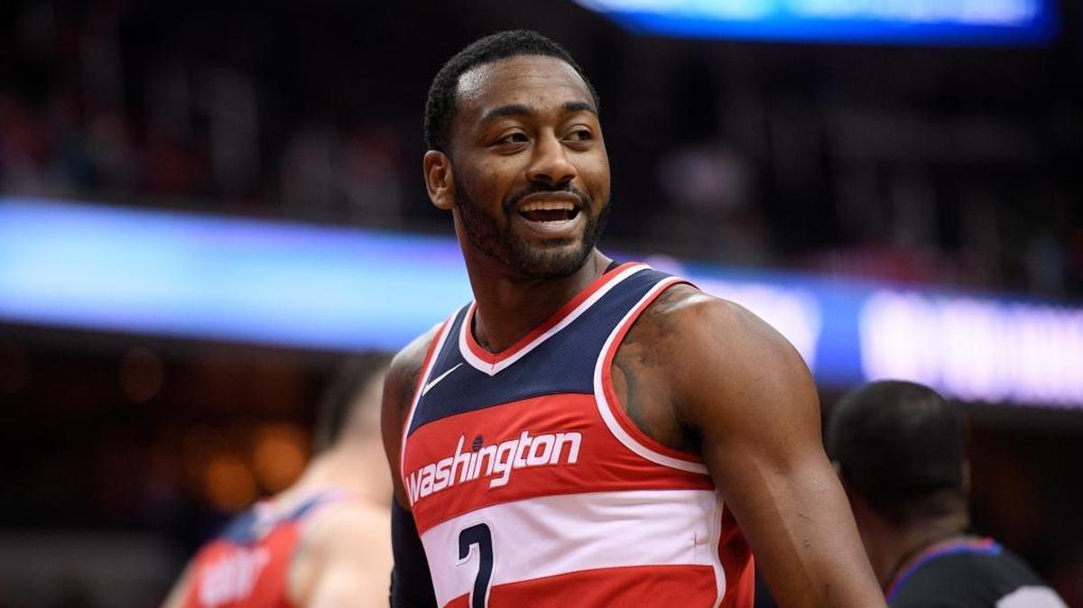Washington Wizards guard John Wall (2) reacts during the first half of an NBA basketball game against the Los Angeles Clippers, Friday, Dec. 15, 2017, in Washington.