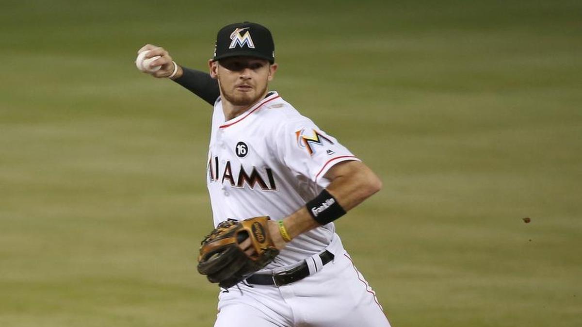 Miami Marlins shortstop JT Riddle unable to put out New York Mets center fielder Curtis Granderson during the third inning of a baseball game at Marlins Park on Thursday, June 29, 2017 in Miami.