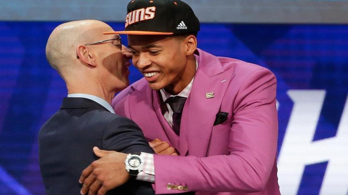 Skal Labissiere, right, is greeted by NBA Commissioner Adam Silver after being selected 28th overall by the Phoenix Suns during the NBA basketball draft, Thursday, June 23, 2016, in New York. (AP Photo/Frank Franklin II)