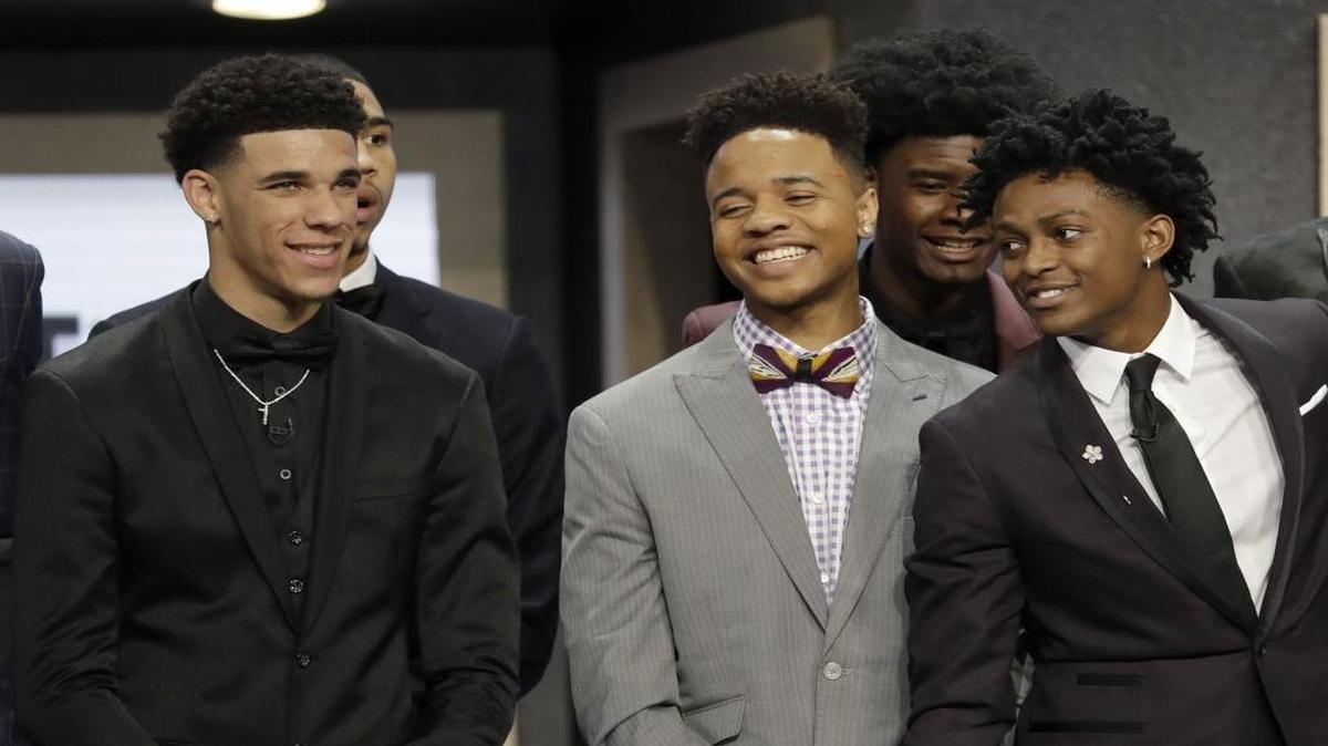 Markelle Fultz is flanked by De'Aaron Fox, right, and Lonzo Ball during a group photo session before the start of the NBA Draft at the Barclays Center in Brooklyn, New York, on Thursday, June 22, 2017.