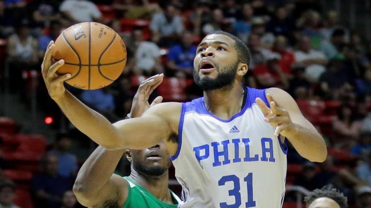Philadelphia 76ers guard Aaron Harrison (31) drove for a layup against Boston Celtics forward Semi Ojeleye during the first half of an NBA summer league game on July 3 in Salt Lake City.