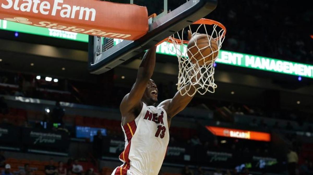 The Miami Heat's Bam Adebayo dunked over the Washington Wizards’ Ian Mahinmi during the second half of a preseason game on Oct. 11, 2017, in Miami.