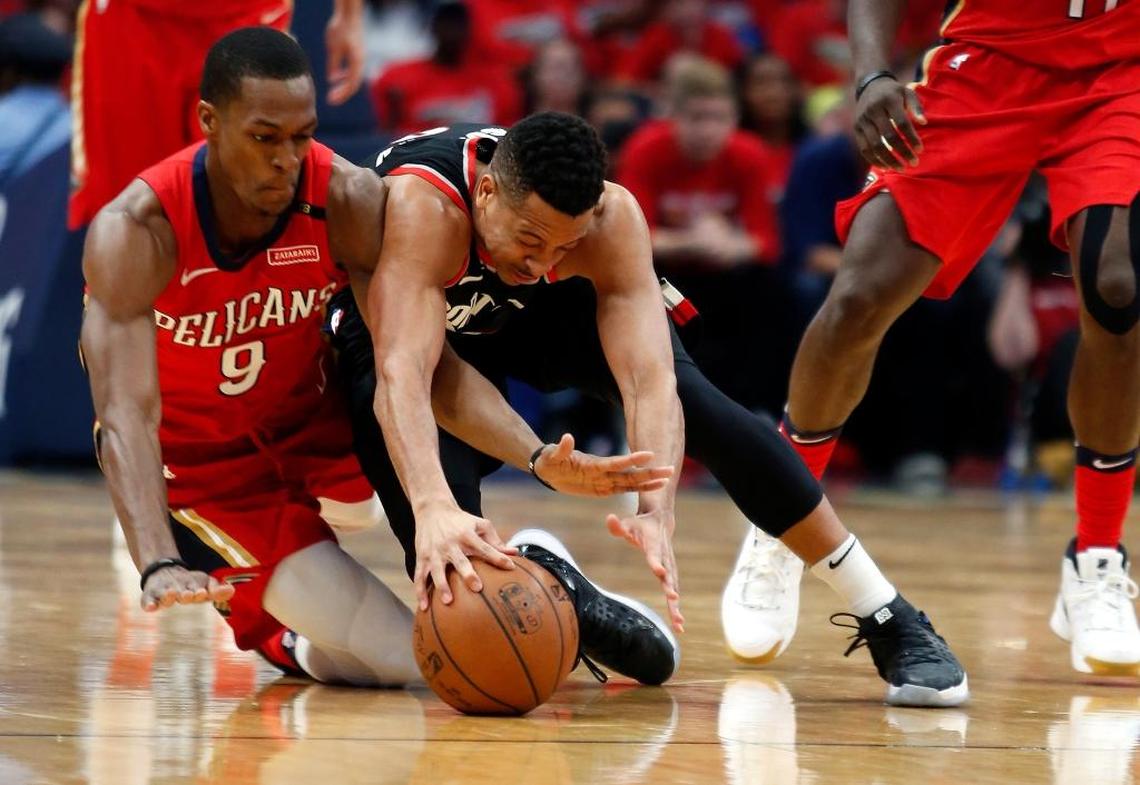 Pelicans guard Rajon Rondo (9) and Trail Blazers guard CJ McCollum battled for a loose ball during the first half of Game 4 of a first-round NBA playoff series in New Orleans on Saturday.
