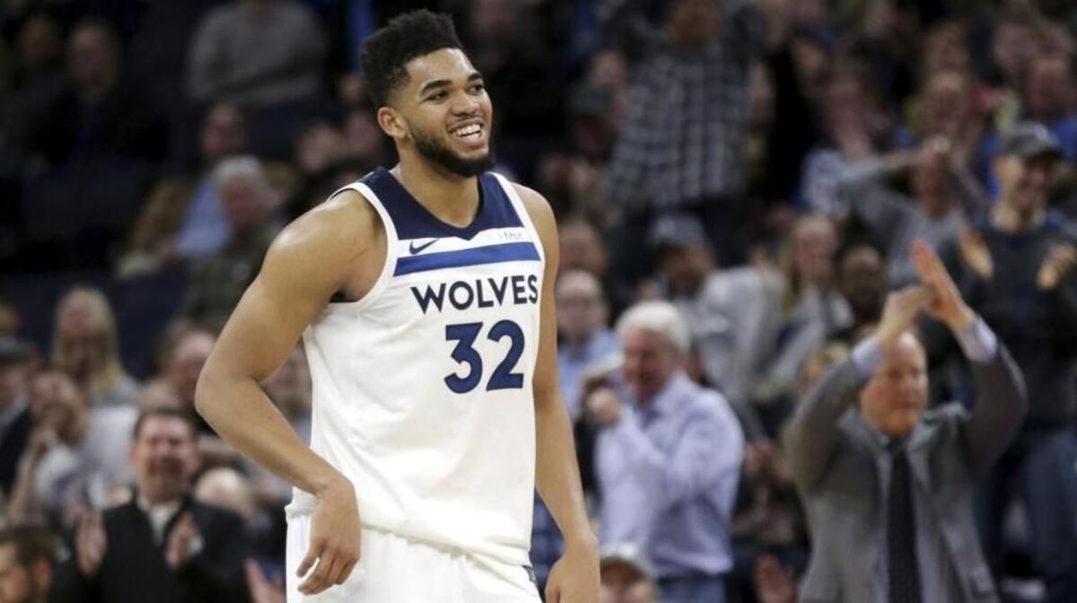 Minnesota Timberwolves forward Karl-Anthony Towns (32) walks of the court during the fourth quarter of the team's NBA basketball game against the Atlanta Hawks on Wednesday, March 28, 2018, in Minneapolis. Towns had a career-high 56 points.
