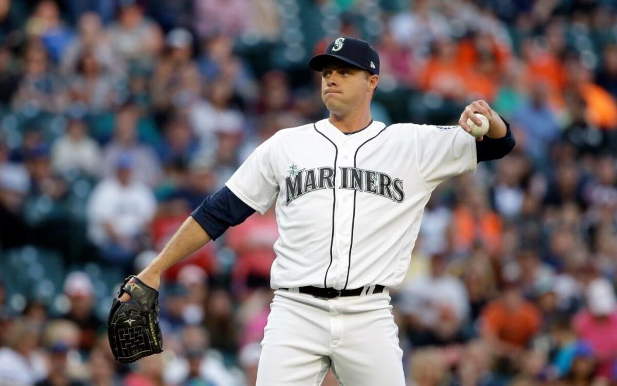 Seattle Mariners starting pitcher Andrew Albers tosses back one ball as he asks for a new one against the Baltimore Orioles in a baseball game Tuesday, Aug. 15, 2017, in Seattle.