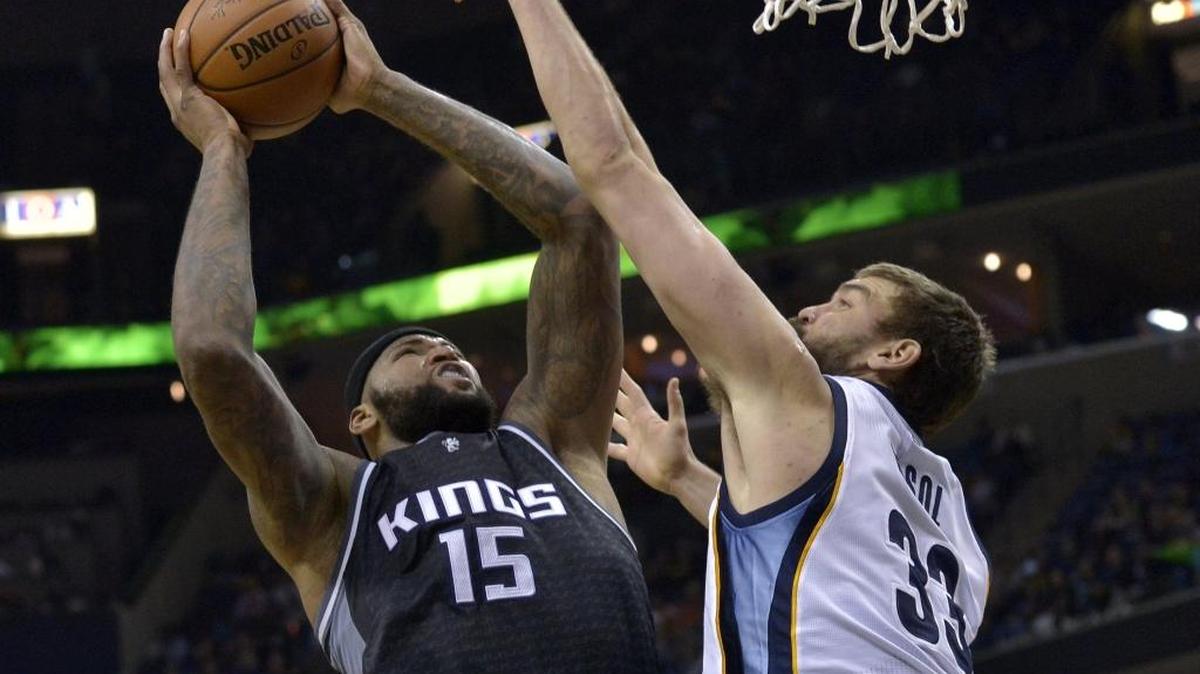 Sacramento Kings forward DeMarcus Cousins (15) shoots against Memphis Grizzlies center Marc Gasol (33) in the first half of an NBA basketball game Friday, Dec. 16, 2016, in Memphis.