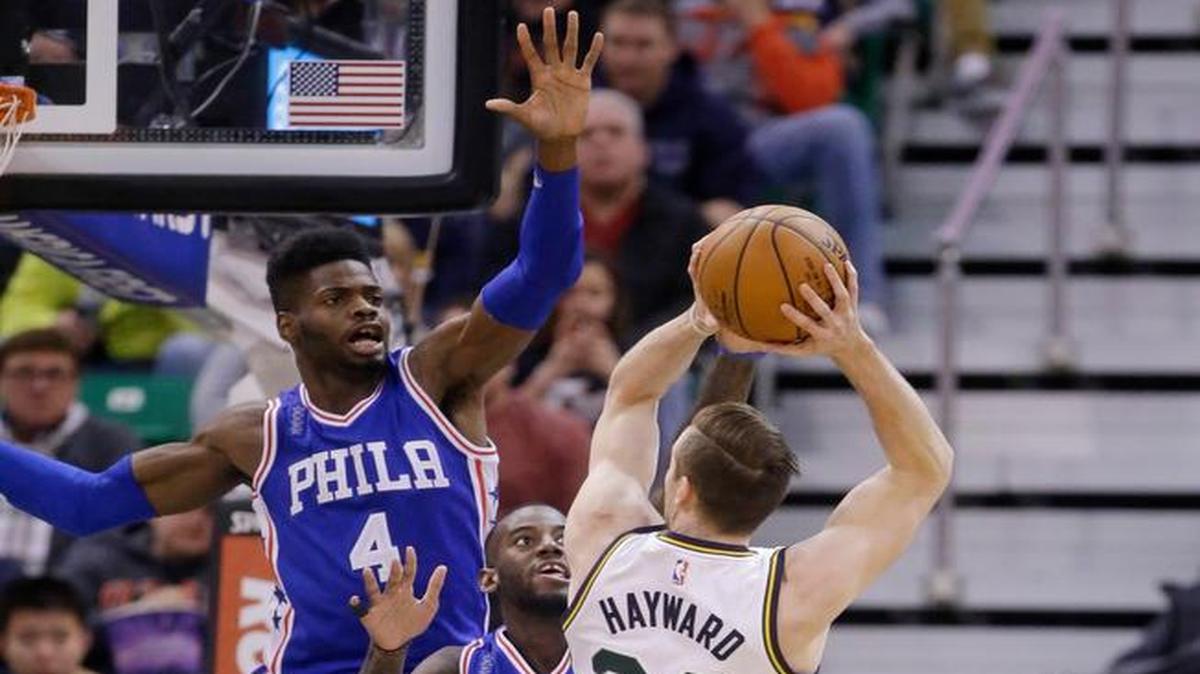 Utah Jazz forward Gordon Hayward (20) shot as the Philadelphia 76ers’ Nerlens Noel (4) and JaKarr Sampson, center, defended during the first quarter Monday, Dec. 28, 2015, in Salt Lake City.
