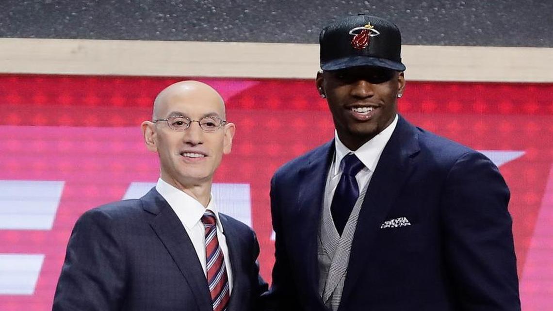 Bam Adebayo, right, poses for photos with NBA Commissioner Adam Silver after being selected by the Miami Heat as the 14th pick overall during the NBA basketball draft, Thursday, June 22, 2017, in New York.
