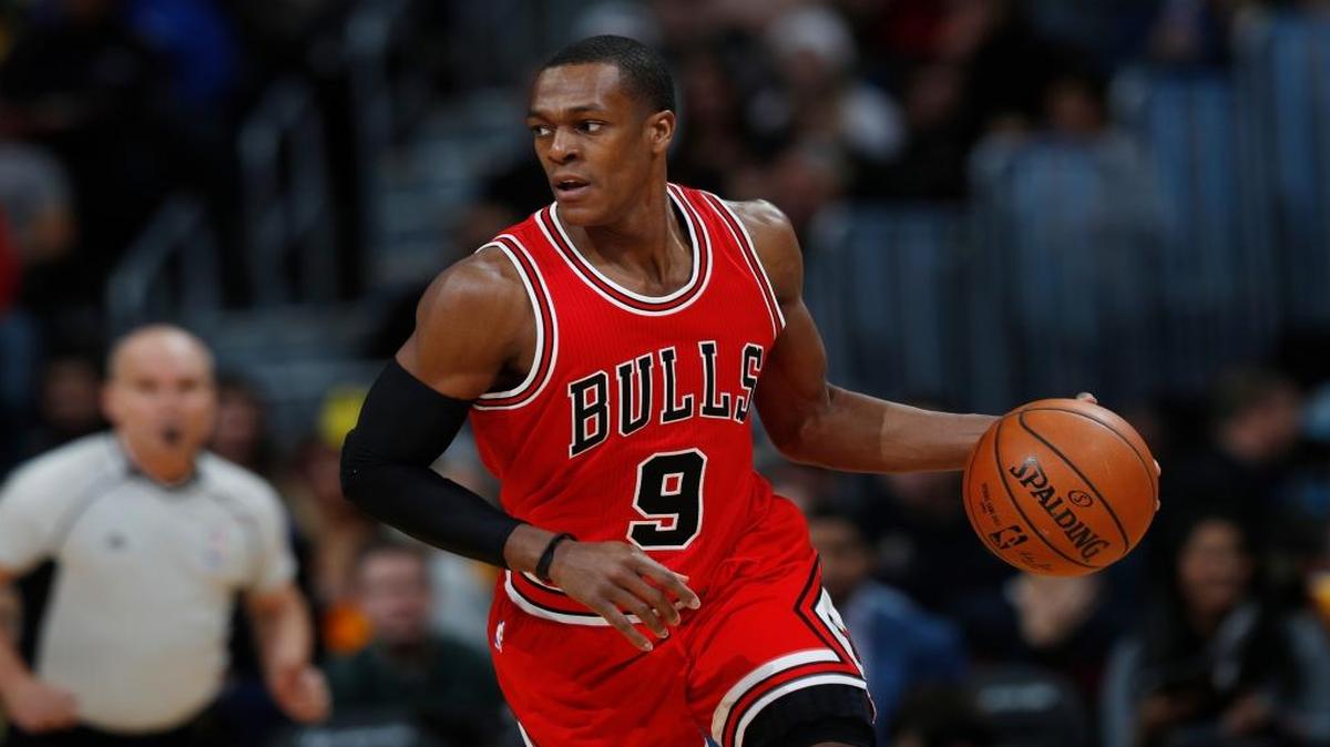Chicago Bulls guard Rajon Rondo brings the ball up the court against the Denver Nuggets in the first half of an NBA basketball game Tuesday, Nov. 22, 2016, in Denver.