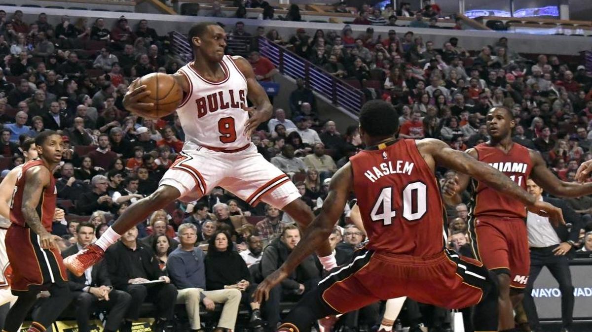 Chicago Bulls guard Rajon Rondo (9) looks to pass the ball around Miami Heat forward Udonis Haslem (40) during the second half of an NBA basketball game in Chicago, Friday, Jan. 27, 2017. The Heat won 100-88.