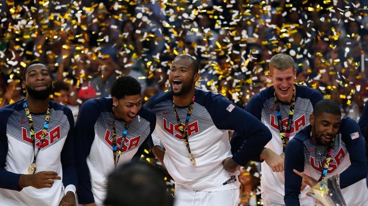 Anthony Davis, second from left, and DeMarcus Cousins celebrated the United States winning the World Cup championship against Serbia at the Palacio de los Deportes stadium in Madrid, Spain, on Sept. 14, 2014.