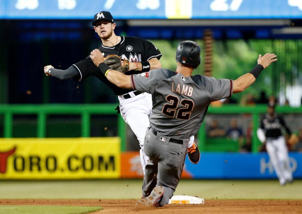 Miami Marlins shortstop JT Riddle threw to first to complete a double play against the Arizona Diamondbacks on June 3.