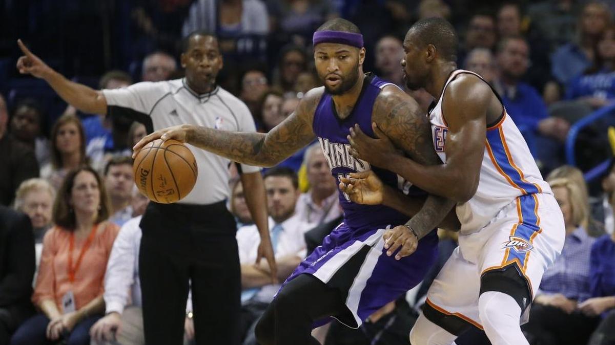 Sacramento Kings forward DeMarcus Cousins, left, drives against Oklahoma City Thunder forward Serge Ibaka, right, in the fourth quarter in Oklahoma City on Monday, Jan. 4, 2016. Sacramento won 116-104.