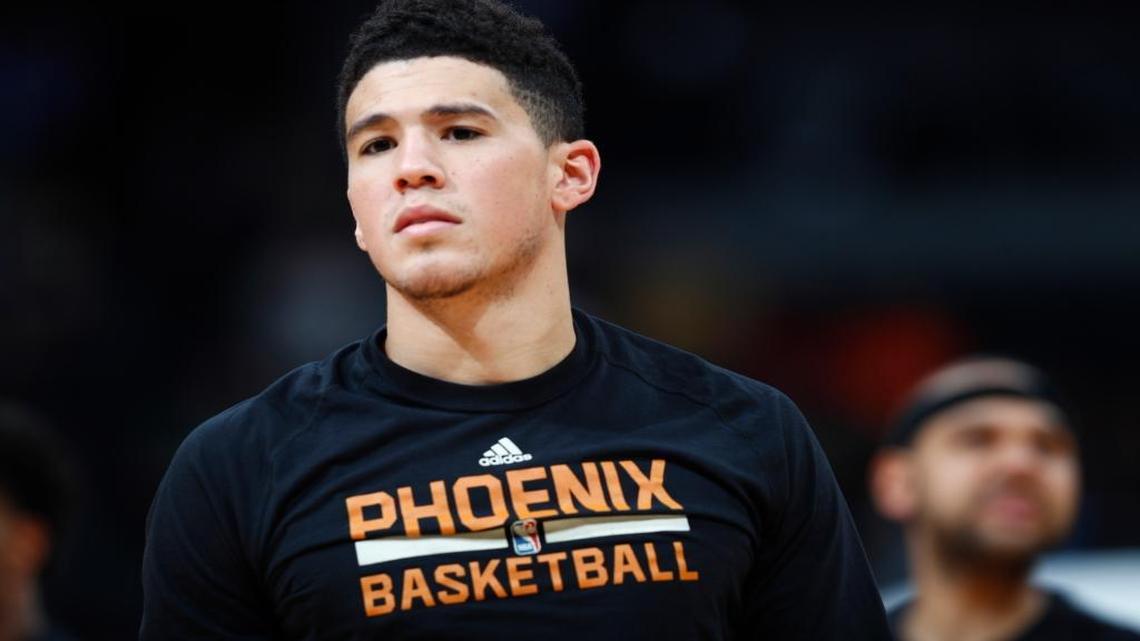Phoenix Suns guard Devin Booker (1) in the second half of an NBA basketball game Thursday, Jan. 26, 2017, in Denver. The Nuggets won 127-120.