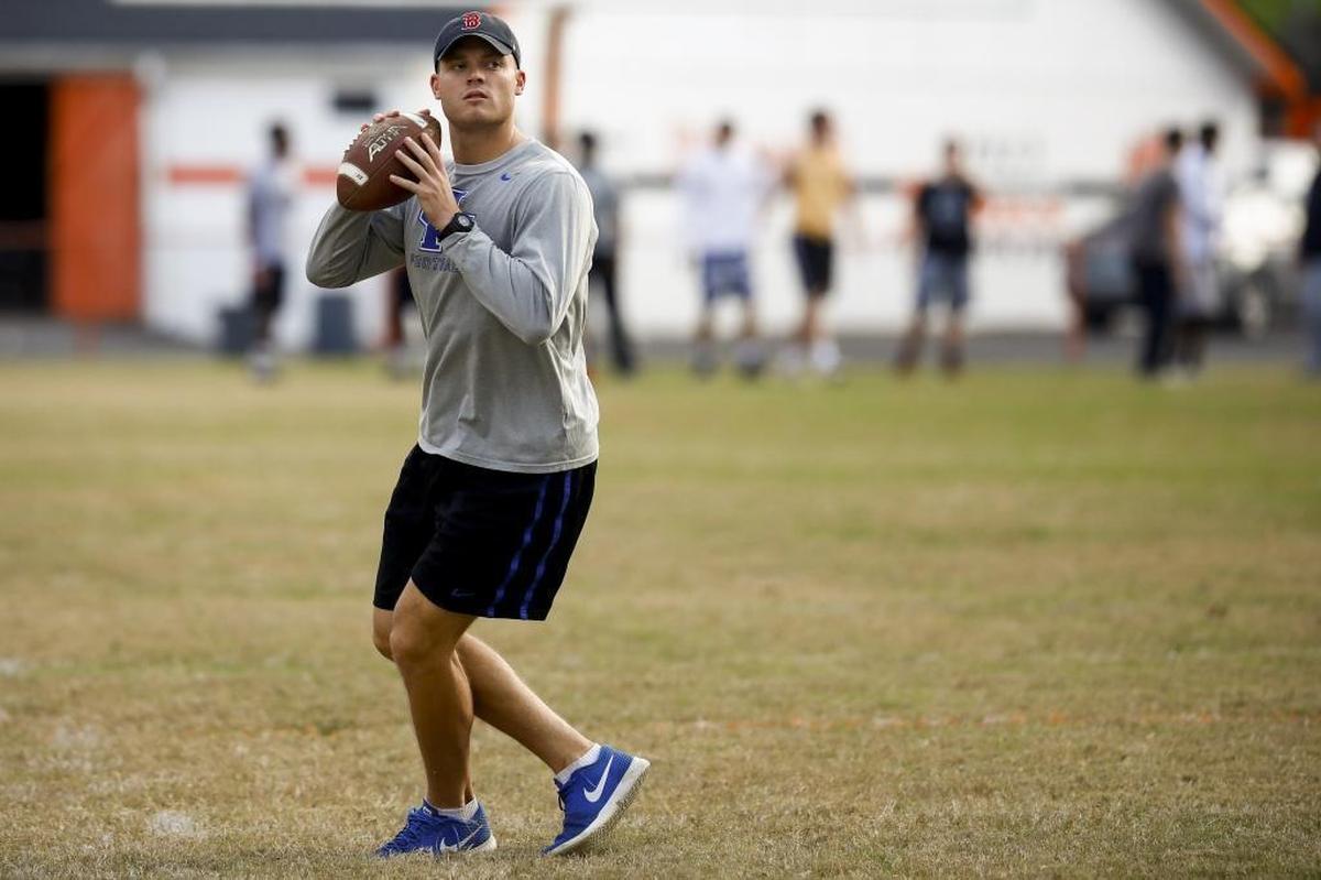 Former University of Kentucky quarterback Patrick Towles drops back to pass the ball during football practice at Blanton Collier Stadium in Paris on Nov. 2, 2017. Towles has found a new purpose after football.