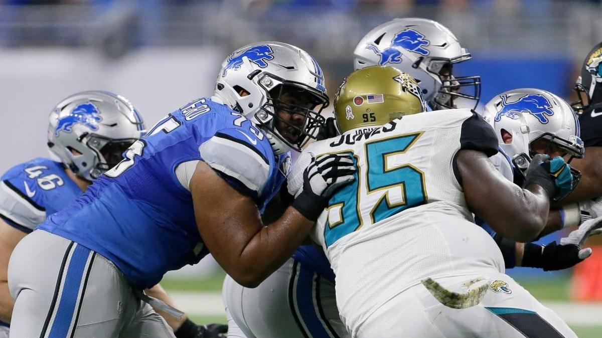 Detroit Lions guard Larry Warford (75) defends against Jacksonville Jaguars defensive tackle Abry Jones (95) during the second half of an NFL football game, Sunday, Nov. 20, 2016 in Detroit.
