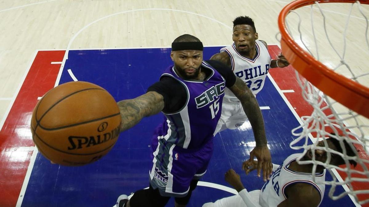 Sacramento Kings' DeMarcus Cousins (15) goes up for a shot against Philadelphia 76ers' Robert Covington (33) during the first half of an NBA basketball game, Monday, Jan. 30, 2017, in Philadelphia.