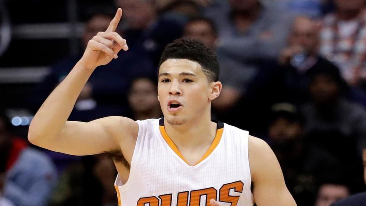 Phoenix Suns guard Devin Booker reacted after making a shot against the Memphis on Monday. Booker is one of four former University of Kentucky stars entered in the NBA skills competition on All-Star Saturday night.