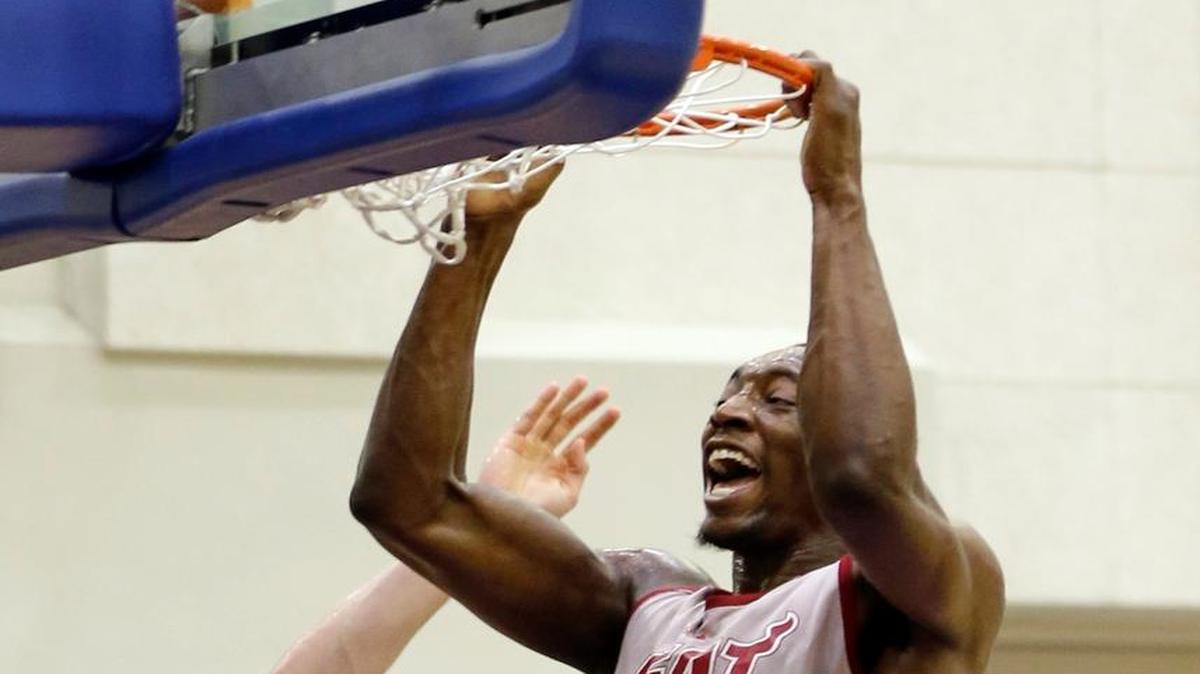 The Miami Heat's Bam Adebayo dunks the ball over the Indiana Pacers’ T.J. Leaf, back left, during the second half of an NBA summer league basketball game, Monday, July 3, 2017, in Orlando, Fla.