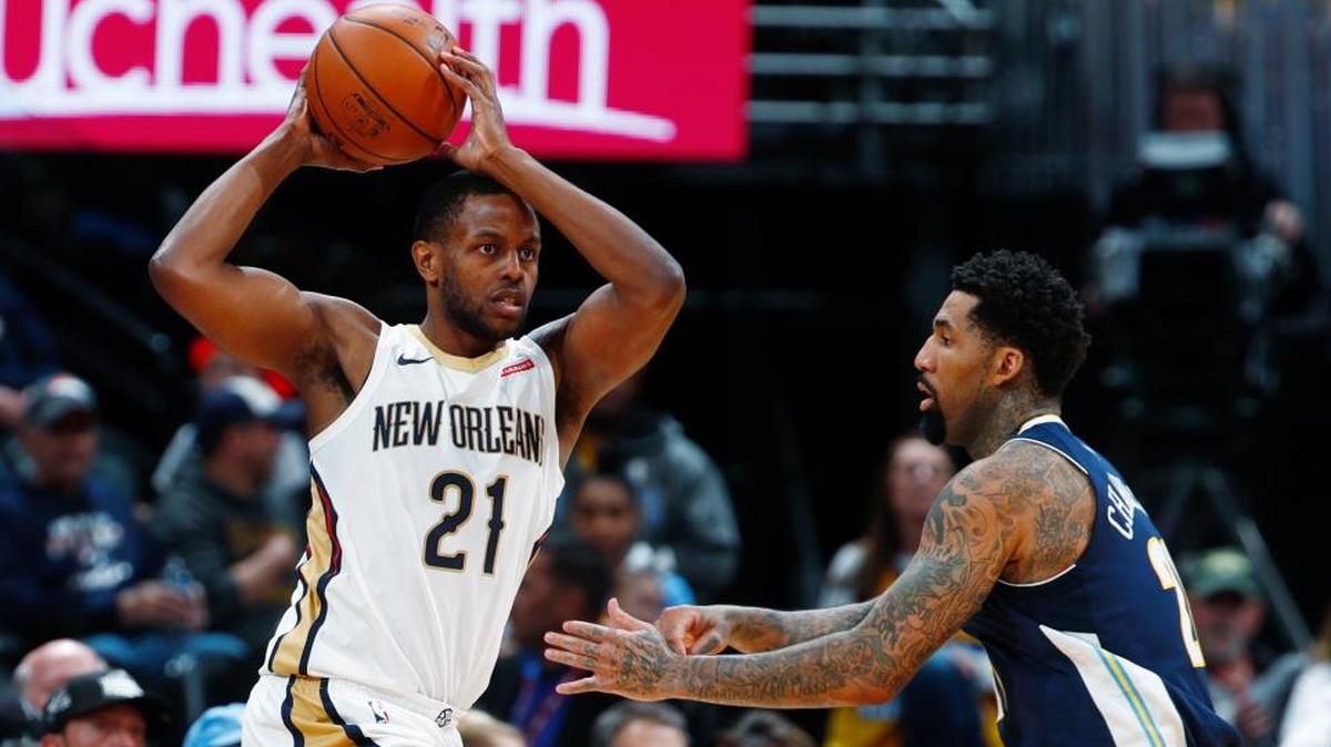 New Orleans Pelicans forward Darius Miller, left, looks to pass the ball as Denver Nuggets forward Wilson Chandler defends during the second half of an NBA basketball game Friday, Nov. 17, 2017, in Denver.