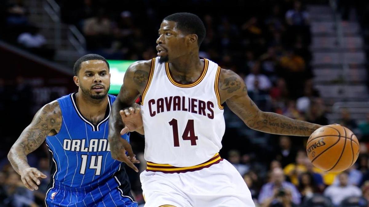 Cleveland Cavaliers' DeAndre Liggins, right, drives past Orlando Magic' D.J. Augustin during the first half of an NBA preseason basketball game Wednesday, Oct. 5, 2016, in Cleveland.