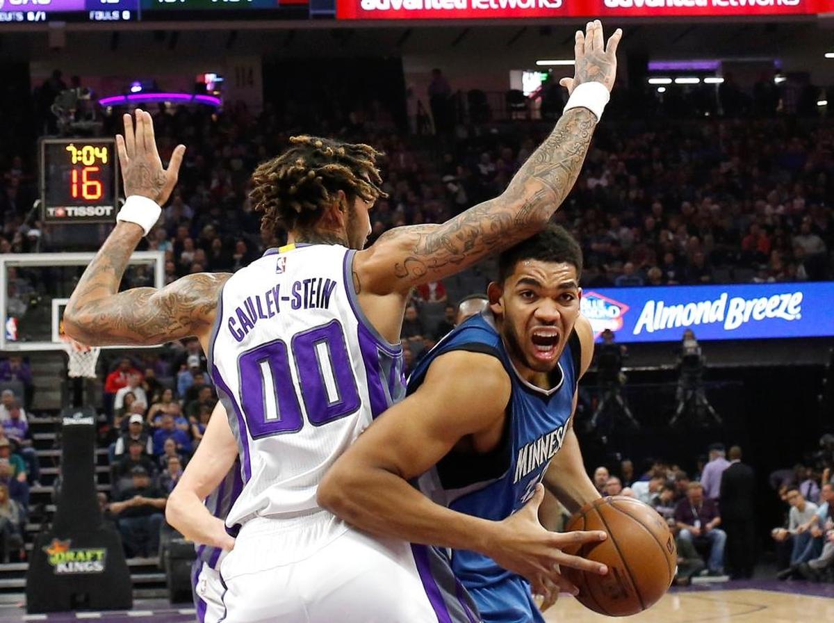 Minnesota Timberwolves center Karl-Anthony Towns goes to the basket against Sacramento Kings center Willie Cauley-Stein during the first half of an NBA basketball game Monday, Feb. 27, 2017, in Sacramento, Calif.
