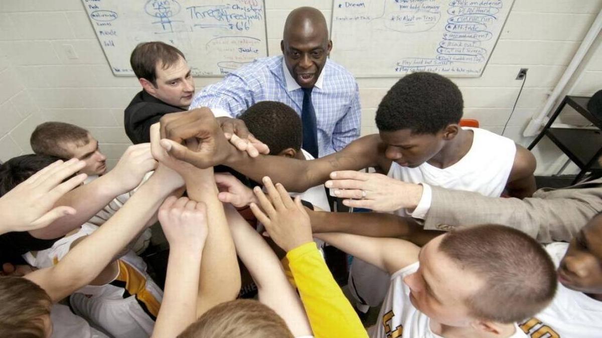 First-year Cordia High School coach Rodrick Rhodes huddled with his team on Dec. 8, 2011, before a home game against Knott County Central.