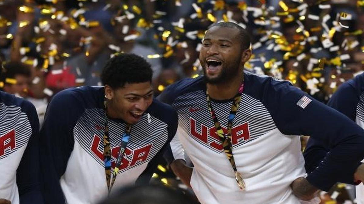 Anthony Davis, second from left, and DeMarcus Cousins celebrated the United States winning the World Cup championship against Serbia at the Palacio de los Deportes stadium in Madrid, Spain, on Sept. 14, 2014.