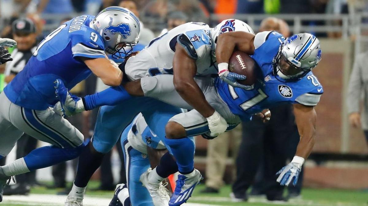Detroit Lions running back Ameer Abdullah (21) is tackled by Tennessee Titans inside linebacker Avery Williamson during the first half Sunday, Sept. 18, 2016, in Detroit.