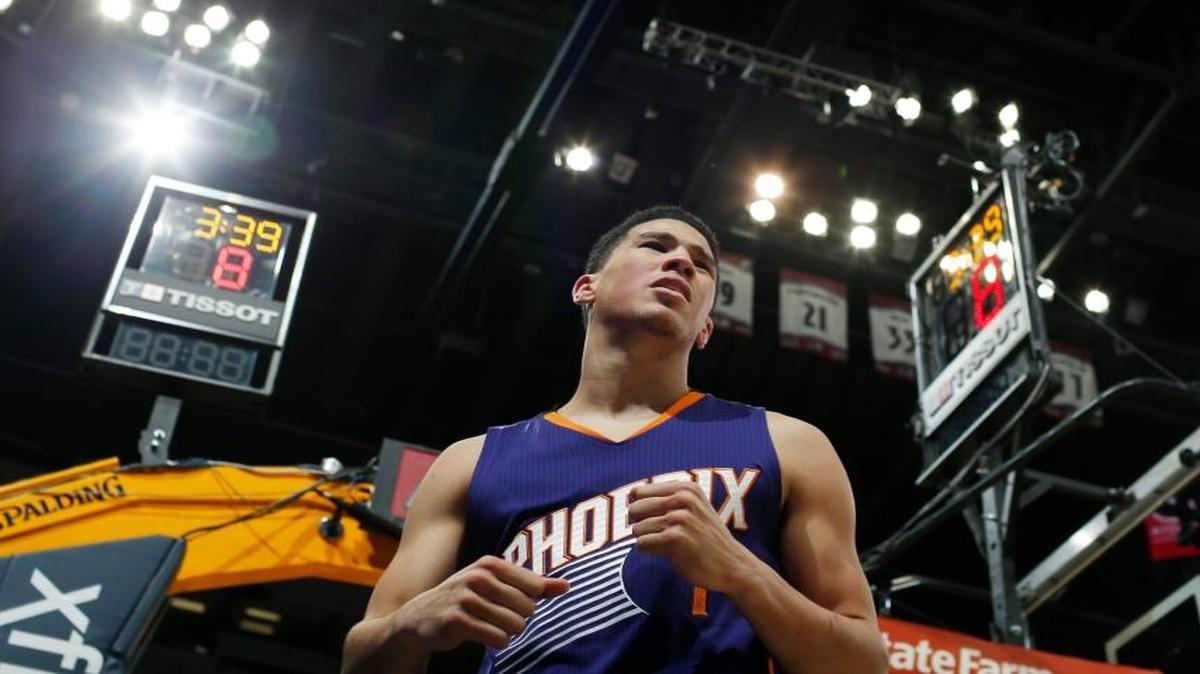 Phoenix Suns guard Devin Booker (1) in the second half of an NBA basketball game Thursday, Jan. 26, 2017, in Denver. The Nuggets won 127-120.