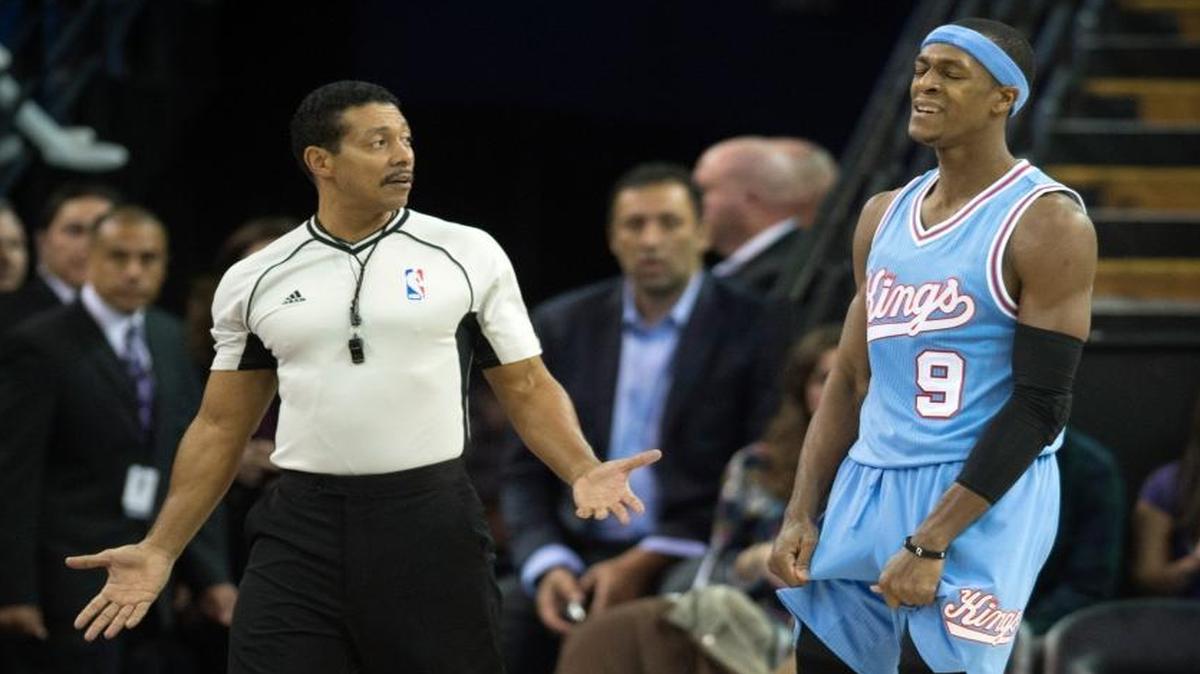 NBA referee Bill Kennedy (55) talked with Kings guard Rajon Rondo (9) during a game against the Timberwolves in Sacramento on Nov. 27. Rondo was suspended for a game after he was given a technical by Kennedy in Mexico City in early December.