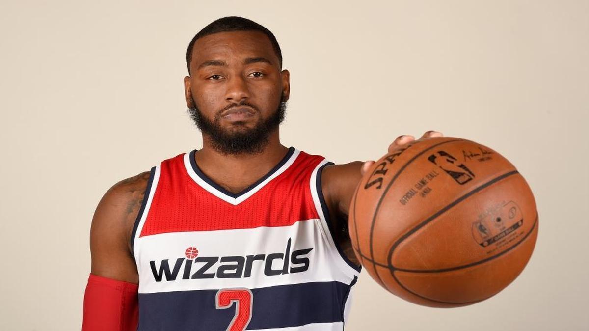 Washington Wizards guard John Wall (2) poses for a photograph during an NBA basketball media day, Monday, Sept. 26, 2016, in Washington.