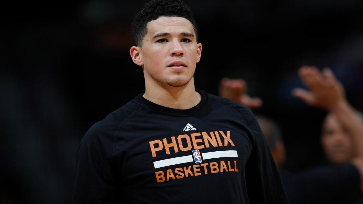 Phoenix Suns guard Devin Booker (1) in the second half of an NBA basketball game Wednesday, Nov. 16, 2016, in Denver. The Nuggets won 120-104.